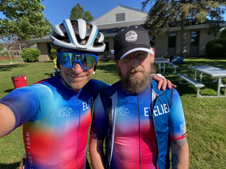 Close up selfie of Chris and Nate post ride looking wiped out but happy